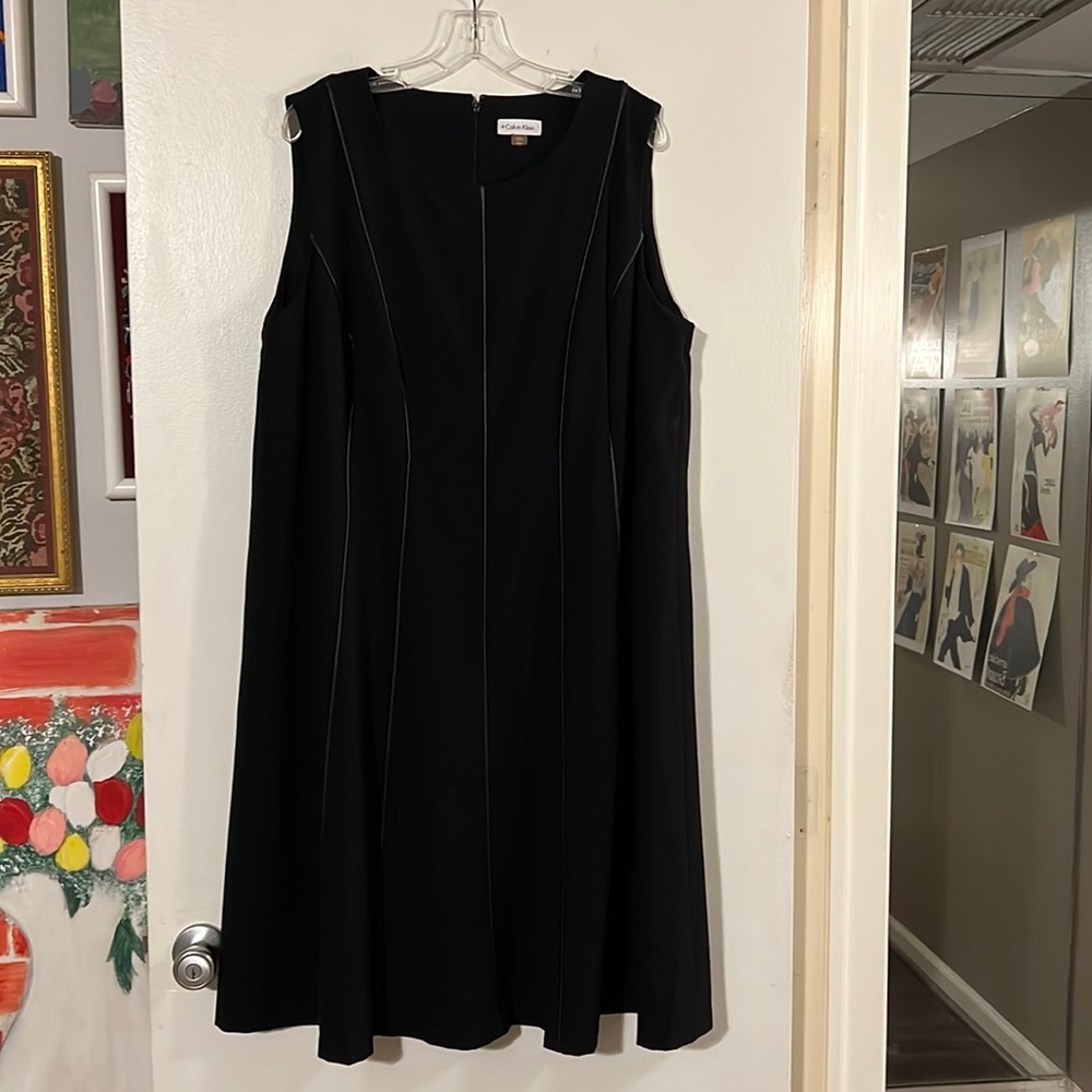 Calvin Klein black sleeveless dress. Back zip closure.